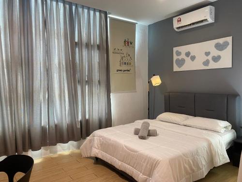 Ένα ή περισσότερα κρεβάτια σε δωμάτιο στο Borneo Hideaway - Manhattan Suites, ITCC