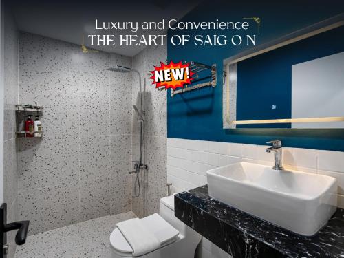 a bathroom with a sink and a toilet in it at The Heart of Saigon - International Plaza - Ho Chi Minh City Hall in Ho Chi Minh City