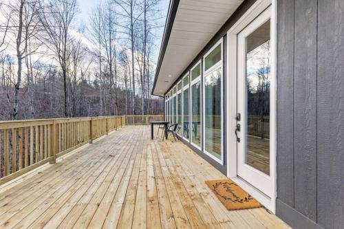 a porch of a house with a bench on it at Primrose - Cave Run Lake OR Red River Gorge KY in Wellington