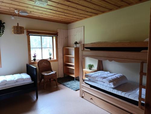 Ένα ή περισσότερα κρεβάτια σε δωμάτιο στο Venjans Campings Vandrarhem