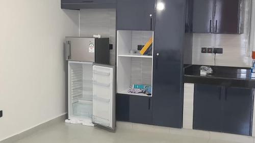 Η κουζίνα ή μικρή κουζίνα στο Mihrab Tamu stay-Nyali