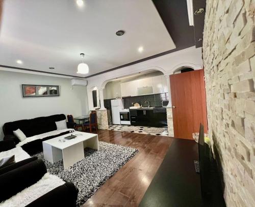 a living room with a couch and a table at PrivatHomeUlcinj1 in Ulcinj