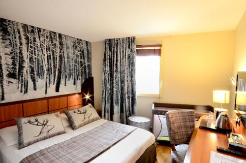 Postel nebo postele na pokoji v ubytování Green hotels Confort Paris 13