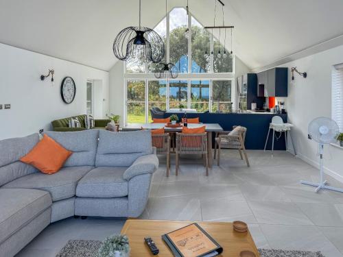 a living room with a couch and a table at Seafields in Sidestrand