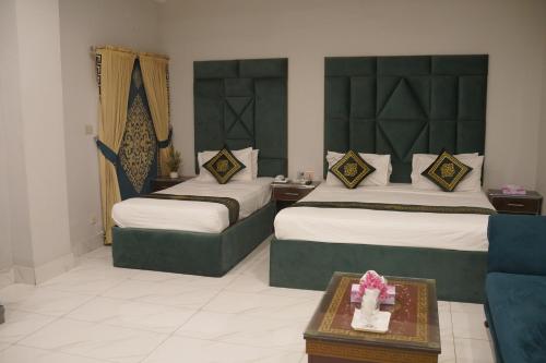 Ένα ή περισσότερα κρεβάτια σε δωμάτιο στο Grand Pearl Hotel