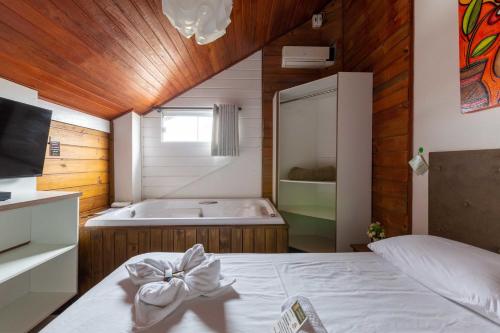 Postel nebo postele na pokoji v ubytování Pousada Recanto do Aconchego