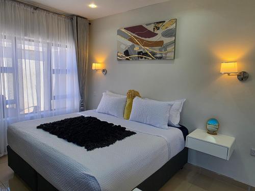 Postel nebo postele na pokoji v ubytování Amakhaya Escape