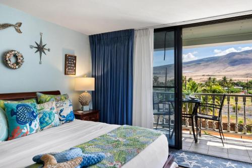 a bedroom with a bed and a balcony at Lahaina Shores 428 · LS 428 Dream Vacation Studio by the Beach a in Lahaina