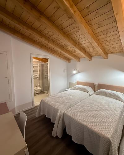 Una cama o camas en una habitación de B&B Battista