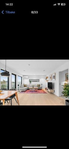 a living room with a couch and a table at Cozy Guest Room in Mandal, Norway - Shared Facilities in Ime