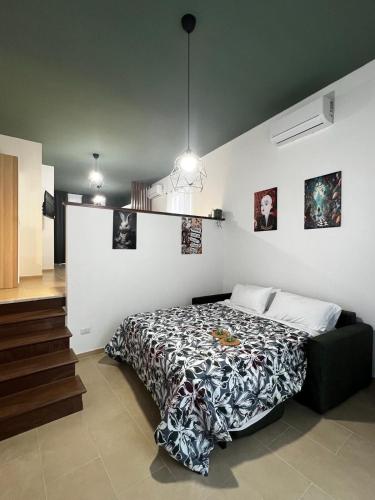 Ένα ή περισσότερα κρεβάτια σε δωμάτιο στο WonderHouse casa vacanze