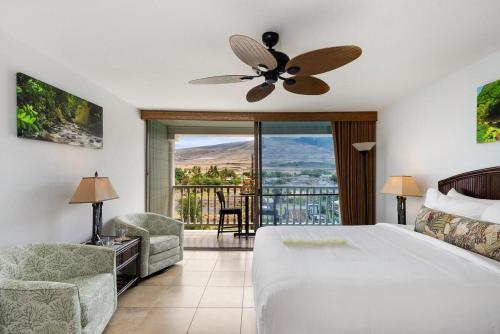 a bedroom with a large bed and a balcony at Lahaina Shores 418 · LS 418 Studio Near Beach, Pool & Relaxing H in Lahaina