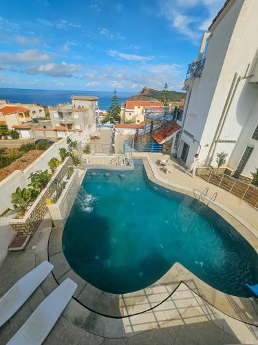 a swimming pool in the middle of a building at Le Chalet di Tabarka in Tabarka
