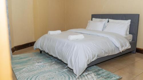 Ένα ή περισσότερα κρεβάτια σε δωμάτιο στο Zen Escape Nanyuki