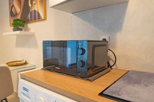 Η κουζίνα ή μικρή κουζίνα στο CityRoss-Apt T3-2 chambres -4 pers-Ste Clotilde