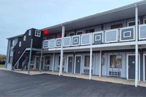 a building with a staircase on the side of it at Economy Inn Merrillville By Townhouse I 65 in Merrillville