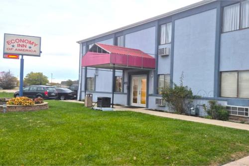 a building with a sign in front of it at Economy Inn By Townhouse Merrillville US 30 in Merrillville