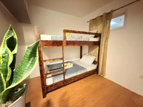 Ένα ή περισσότερα κρεβάτια σε δωμάτιο στο The Terrace Condominium