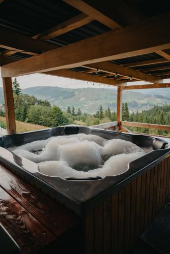 a large bath tub filled with foam on a table at Готель Еко-Міївка in Krasnik
