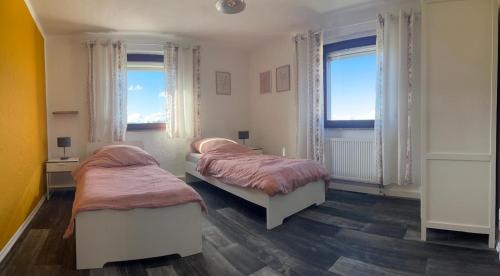 Postel nebo postele na pokoji v ubytování Eifel Moments