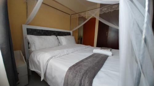 Postel nebo postele na pokoji v ubytování Unique Place Thika 1 Bedroom