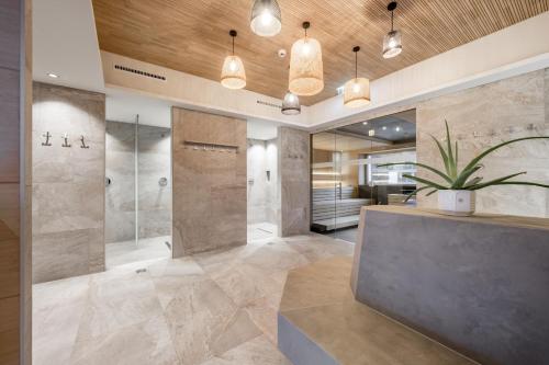 a bathroom with a shower and a sink at Camping Sölden Apartments in Sölden