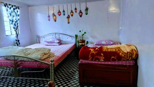 Postel nebo postele na pokoji v ubytování Ekaanta Aabaash