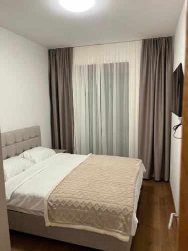 Postel nebo postele na pokoji v ubytování Apartman Lux Capital