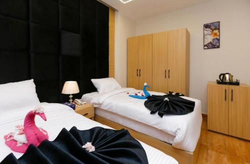 Postel nebo postele na pokoji v ubytování Honey OF The Pyramids