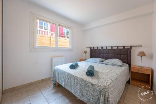 Ένα ή περισσότερα κρεβάτια σε δωμάτιο στο Entre plages et port