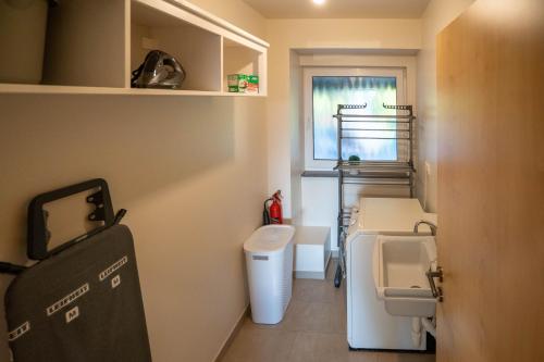 a small bathroom with a toilet and a sink at Ferienwohnung - Ewigkeit in Minden