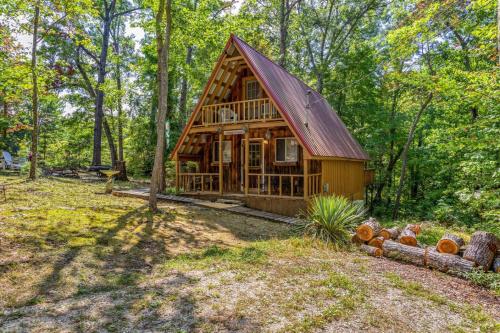 a log cabin in the woods with trees at Sugar Shack - Cave Run Lake OR Red River Gorge KY in Bangor