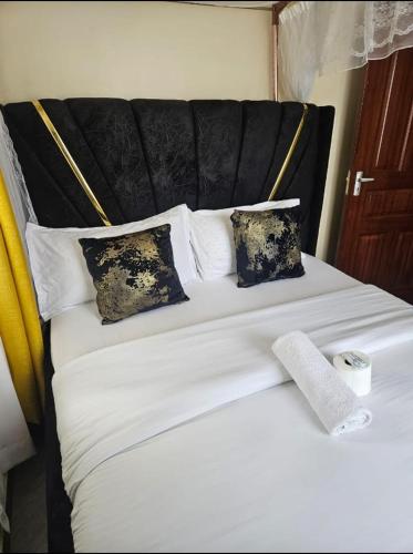 Ένα ή περισσότερα κρεβάτια σε δωμάτιο στο Excelesior bnb