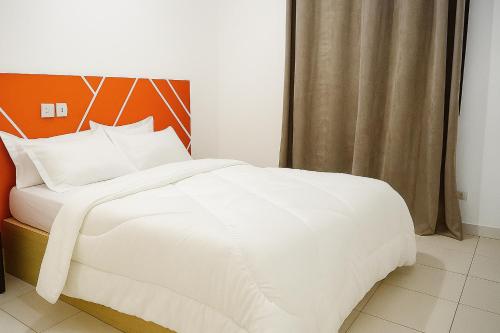 Ένα ή περισσότερα κρεβάτια σε δωμάτιο στο Au cœur de Angré la djibi