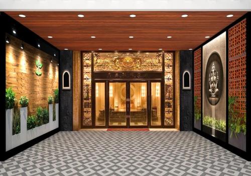an entrance to a building with a large glass door at Hotel Darshan Inn in Prayagraj