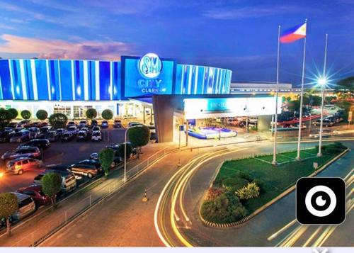 a view of a car dealership at night at MisyEdz Homes Dau Good for 2 near Clark, SNR,Malls, Airport in Mabalacat