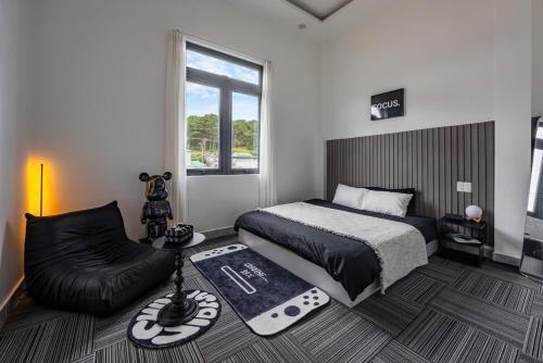 a bedroom with a bed and a couch at Bae Villa Đà Lạt in Da Lat
