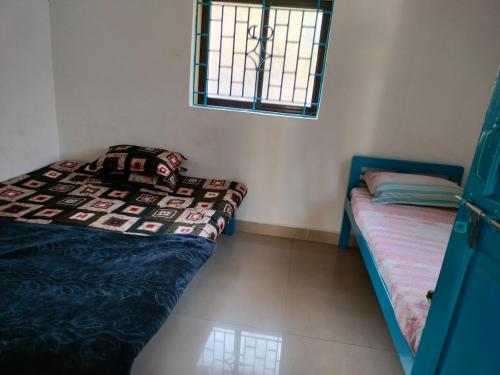 Ένα ή περισσότερα κρεβάτια σε δωμάτιο στο The Maze House Anjuna!