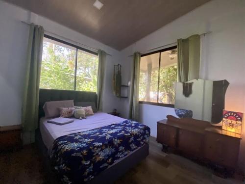 Ένα ή περισσότερα κρεβάτια σε δωμάτιο στο Casa de Congos