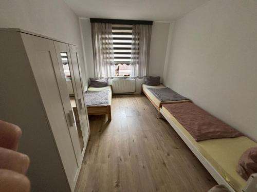 En eller flere senge i et værelse på Speedstay Marxloh