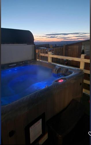 a jacuzzi tub on top of a house at Bunny Meadows Holiday Farmhouse near Carmarthen & Pembrokeshire in Carmarthen