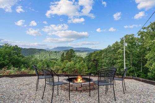 a patio with two chairs and a fire pit at John Wayne View cabin in Del Rio