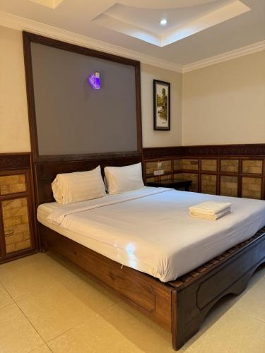 Ένα ή περισσότερα κρεβάτια σε δωμάτιο στο Velora residency