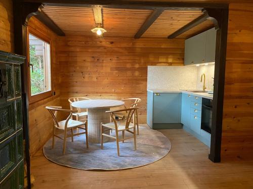 a kitchen with a table and chairs in a room at Ruhige Hütte mit toller Aussicht in Dammbach