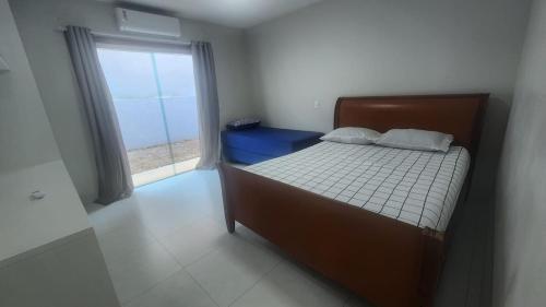 Postel nebo postele na pokoji v ubytování Cultura Viagens Home