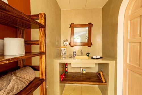 a bathroom with a sink and a bunk bed at La Maison - Siquijor in Siquijor