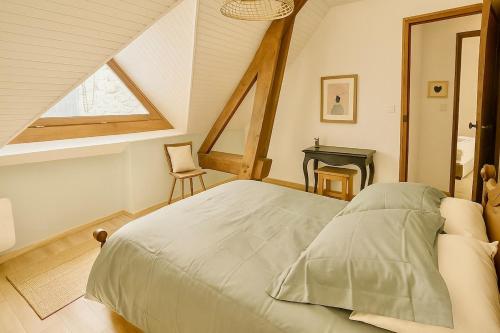 En eller flere senge i et værelse på Maison de montagne, charme alpin & cheminée