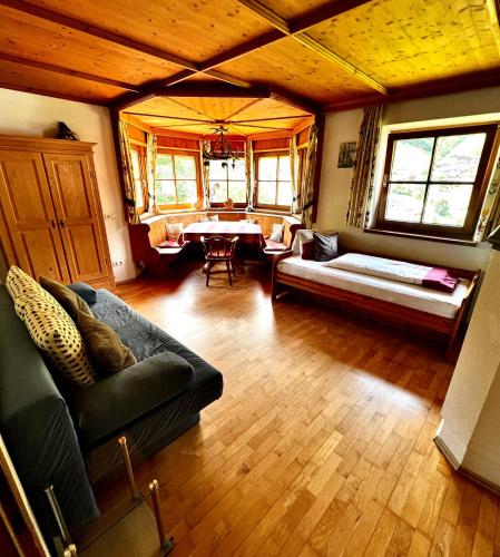 a living room with a couch and a table at Lexhof in Sellrain