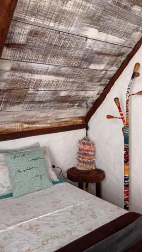 En eller flere senge i et værelse på Cabana Sem'ente Paraty