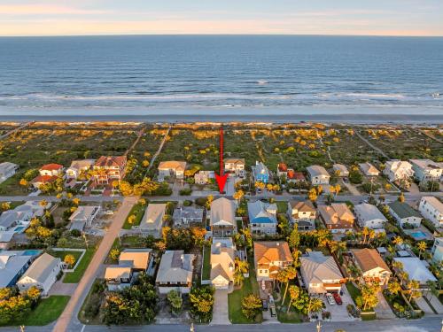 an aerial view of a town with houses and the ocean at Aqua Vista l Beach Views I Pool Spa in Butler Beach